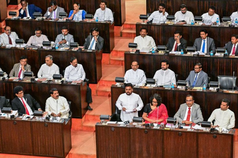 Sri Lanka's President Anura Kumara Dissanayake (C) presents the 2026 budget to parliament in Colombo on November 7, 2025.