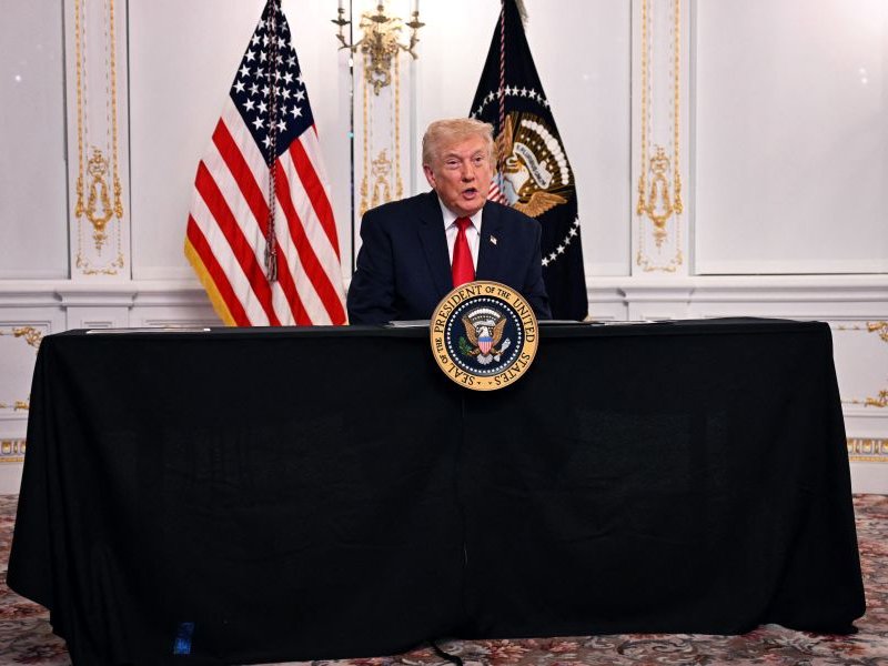 US President Donald Trump participates in a video call with military service members from his Mar-a-Lago residence in Palm Beach
