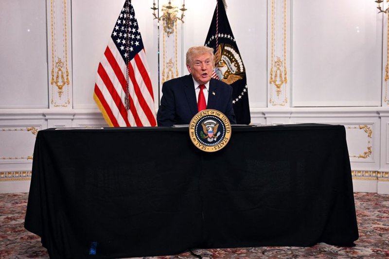 US President Donald Trump participates in a video call with military service members from his Mar-a-Lago residence in Palm Beach