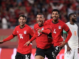 Egypt's defender #5 Ramy Rabia celebrates his goal with Egypt's midfielder #14 Hamdy Fathy and Egypt's defender #4 Hossam Abdelmaguid during the Africa Cup of Nations (CAN) quarter-final football match between Egypt and Ivory Coast