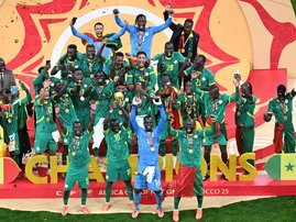 Senegal players celebrate with the trophy after winning the Africa Cup of Nations