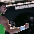 Spain's Carlos Alcaraz reacts after winning the second set against Germany's Yannick Hanfmann during their men's singles match on day four of the Australian Open tennis tournament