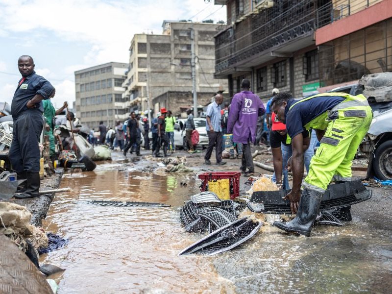 People salvage property from receding flood waters in downtown Nairobi
