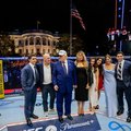 US President Donald Trump, US First Lady Melania Trump, UFC CEO Dana White and other guests stand inside the Octagon at UFC Freedom 250 on the South Lawn of the White House in Washington, DC