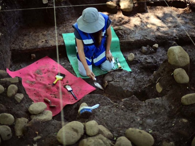 Mexican archaeologist Mireya Moreno extracts artifacts at an archaeological site in Coatepec, Veracruz, Mexico