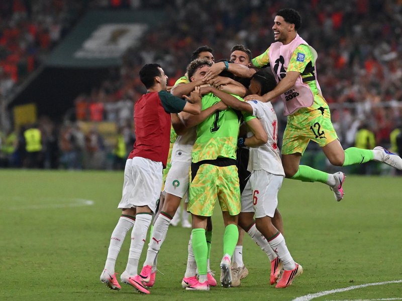 Morocco players celebrate after winning in the shootout