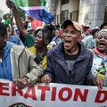 Protesters chant slogans as they march during a demonstration by "March and March"