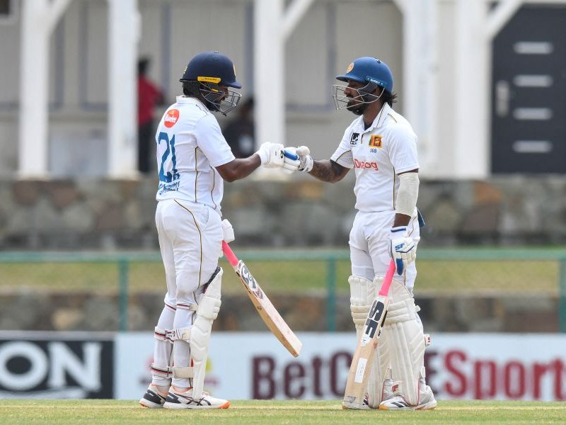 Kamindu Mendis (L) and Lahiru Udara (R) of Sri Lanka celebrate their 150 runs partnership during the 1st day of the 2nd Test between Sri Lanka and West Indies