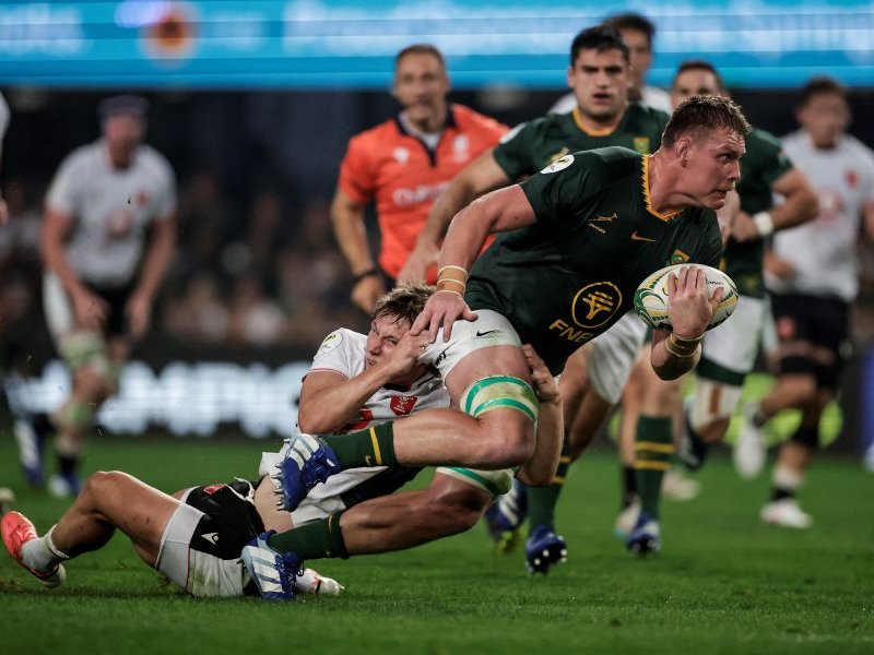 Wales' wing Ellis Mee (L) tackles South Africa's lock Cobus Wiese (R) during the rugby Nations Championship match between South Africa and Wales at Kings Park Stadium in Durban on July 18, 2026