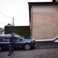 French Gendarmes gather outside the house where the bodies of two infants have been discovered in a freezer