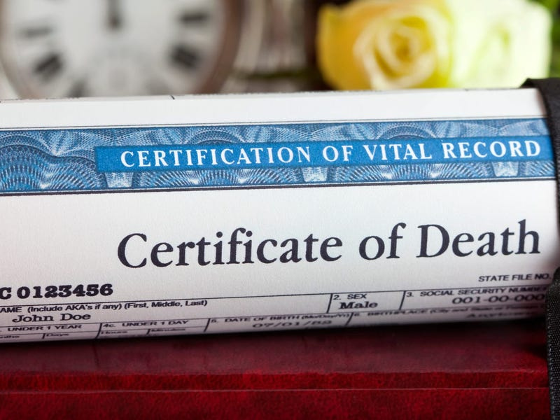 A Death certificate with a black ribbon