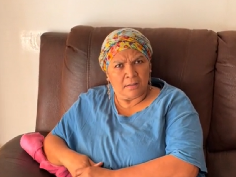 A South African woman with a scarf on her head