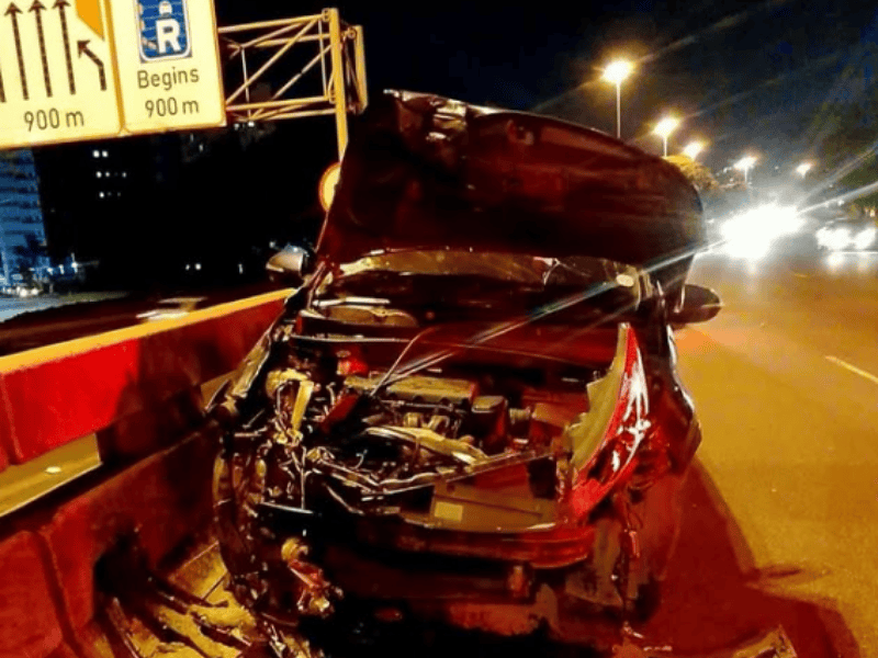 A badly damaged vehicle that was in an accident on the roadside
