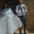 A bride wearing a wedding dress next to her groom