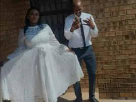 A bride wearing a wedding dress next to her groom