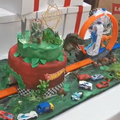 A cake with a race track for a birthday