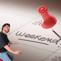 A calendar with a red pin attached to the weekend date and Danny Guselli looking at it