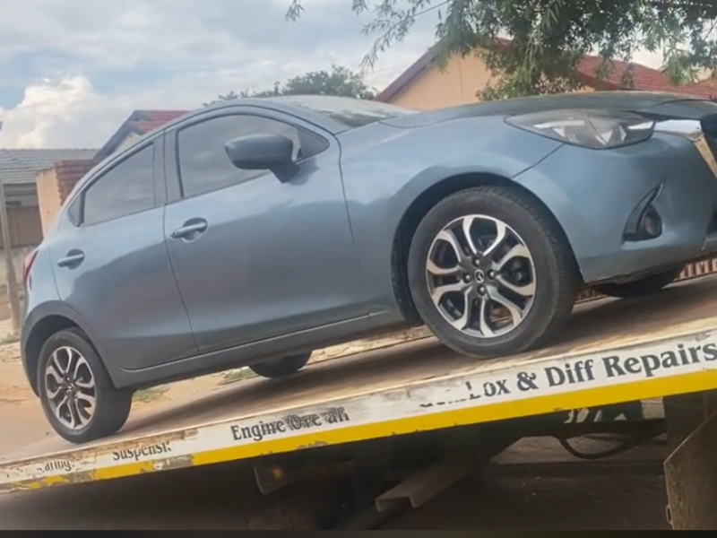 A car being lifted by a tow truck