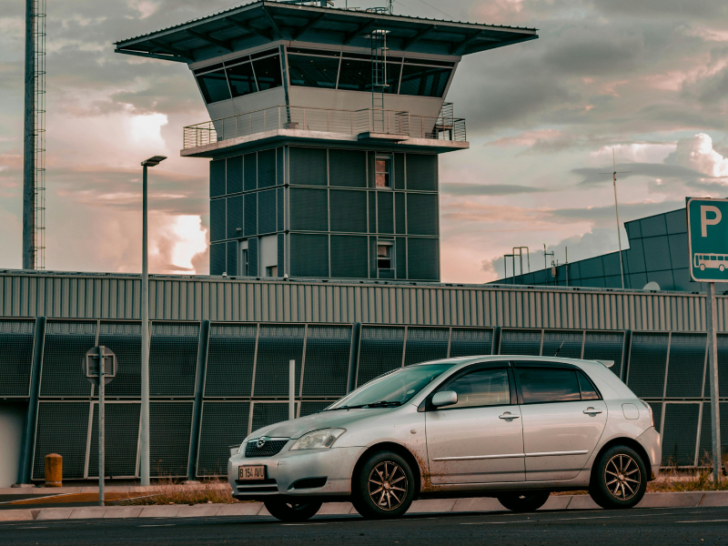 A car near the airport tower