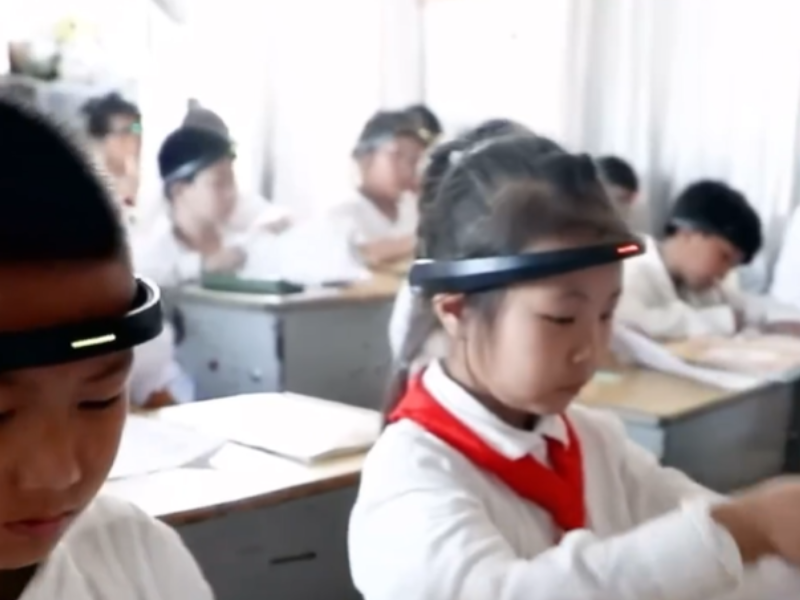 A classroom of Chinese students wearing headbands