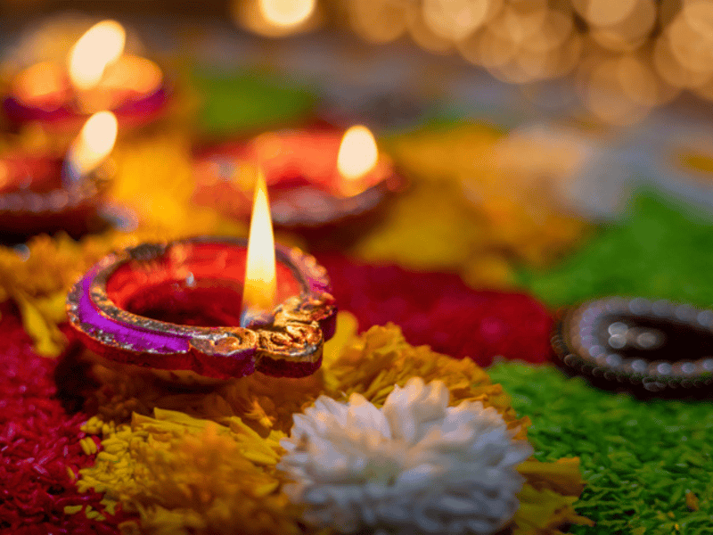 A clay diya lamp lit with wick and oil during Diwali celebration