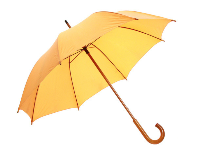 A closeup shot of a yellow umbrella on white background