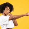 A confident black woman in a fighting pose
