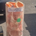 A container full of false teeth being sold at a stall