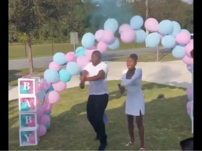 A couple at their gender reveal party excited about the news