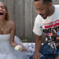 A couple holding champagne flutes after finding out the gender of their baby