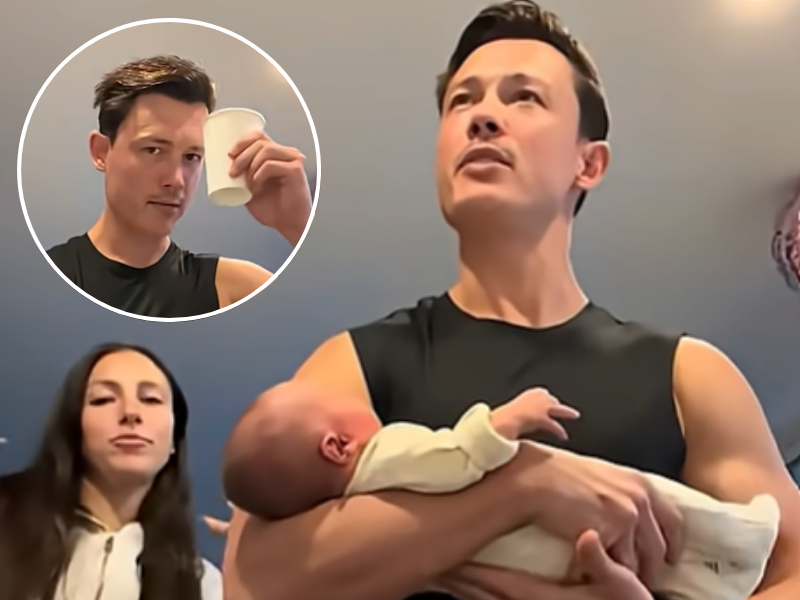 A couple standing in the kitchen with their baby about to drink breastmilk coffee