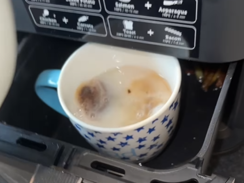 A cup of tea being made inside an air fryer