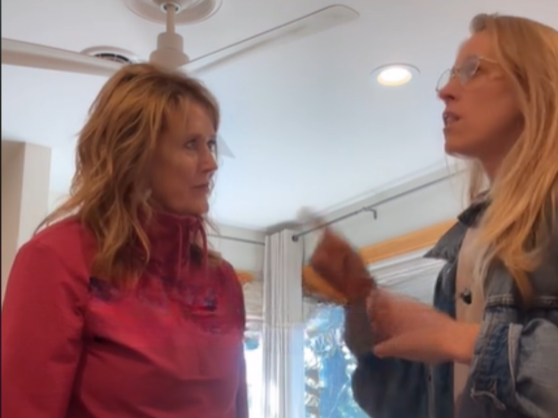 A daughter speaks to her mother in an intense manner