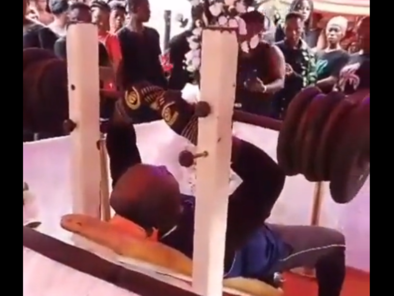 A dead man is laid to rest on a gym press bench