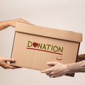 A donation box is being handed over to a volunteer