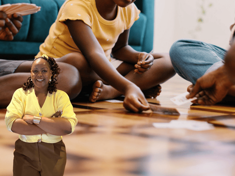 A family playing cards on their living room floor