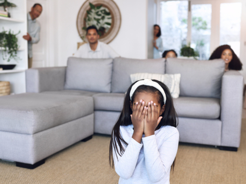 A family playing hide and seek at home