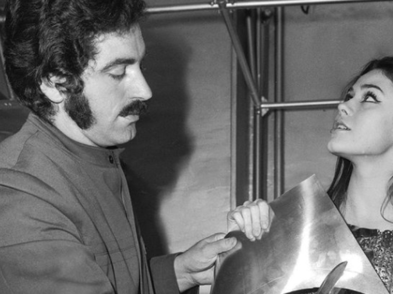 A fashion designer working with a model