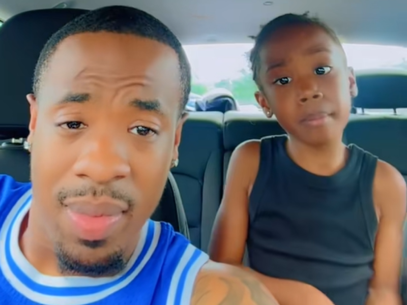 A father and daughter singing inside the car