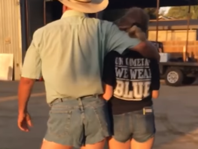 A father and daughter wearing tiny denim shorts side by side