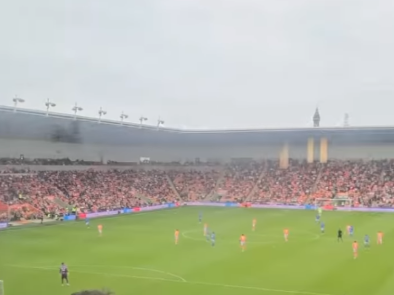 A football match in England being watched from a hotel room