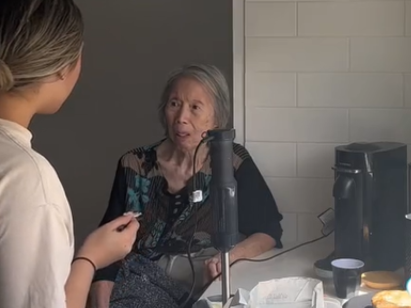 A grandmother eating something