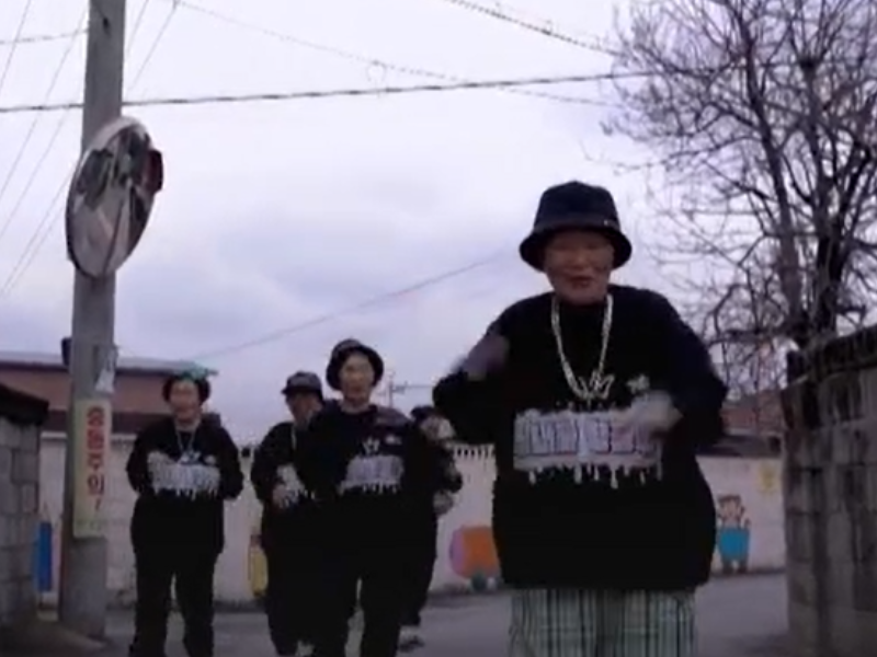 A group of Asian grandmothers wearing baggy clothes