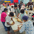 A group of volunteers gather at the community centre in Chatsworth to make roti