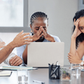 A group shot of business people looking stressed