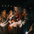 A happy family celebrating Diwali with sparkling fireworks