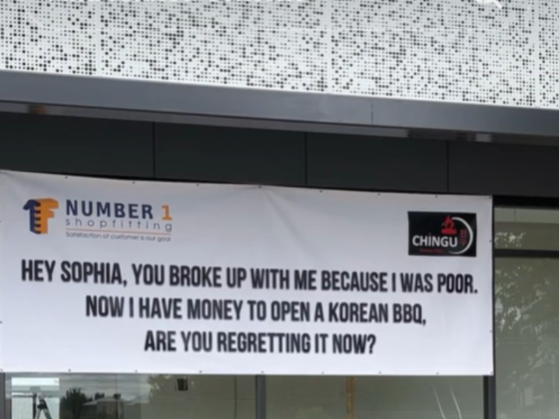 A large sign on a shopfront building in Australia