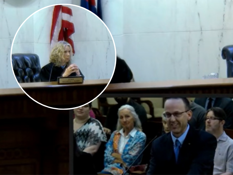 A lawyer speaking to a panel of judges in an American courtroom