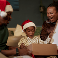 A little boy opening his gifts during Christmas