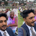 A male teacher wearing a suit runs away from his matric students